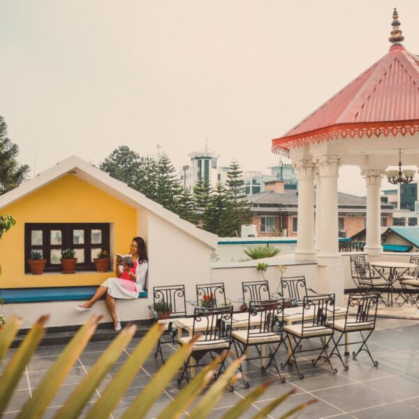 Women Reading book at Maya Manor Boutique Hotel